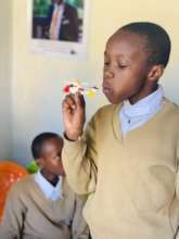 Student Blowing Lego Plane He Built