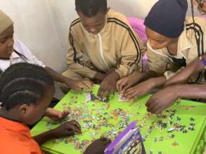 Students Putting Together a Puzzle