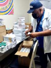 Wayuu Taya team member checks on a donation.