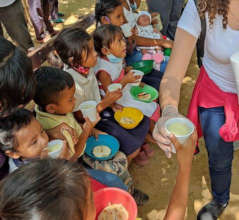 Giving food to children in communities