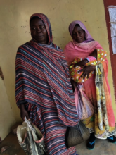 Families receive food items and seeds to plant