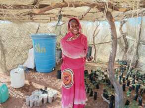 Women thrilled to receive trees to plant at home