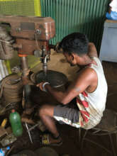 Welder working on final batch of kilns