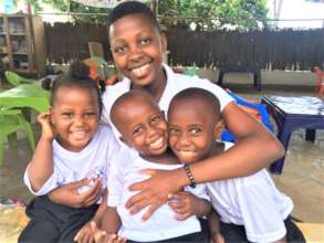 Pendo volunteering with some of our kids