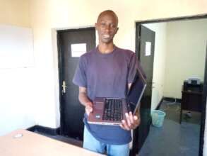 One of three computer recipients in Rwanda, 7/2022
