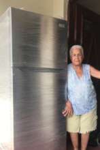 Lady receiving her new fridge