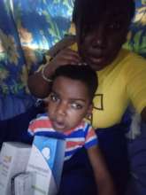 Children receiving toys and food products