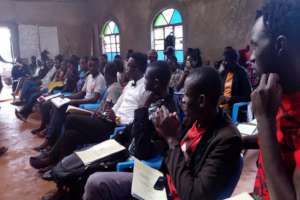 Bidii Youths watch educative video during training