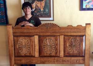 James with headboard he made in class.