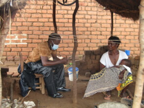 An enumerator collects data on a tablet