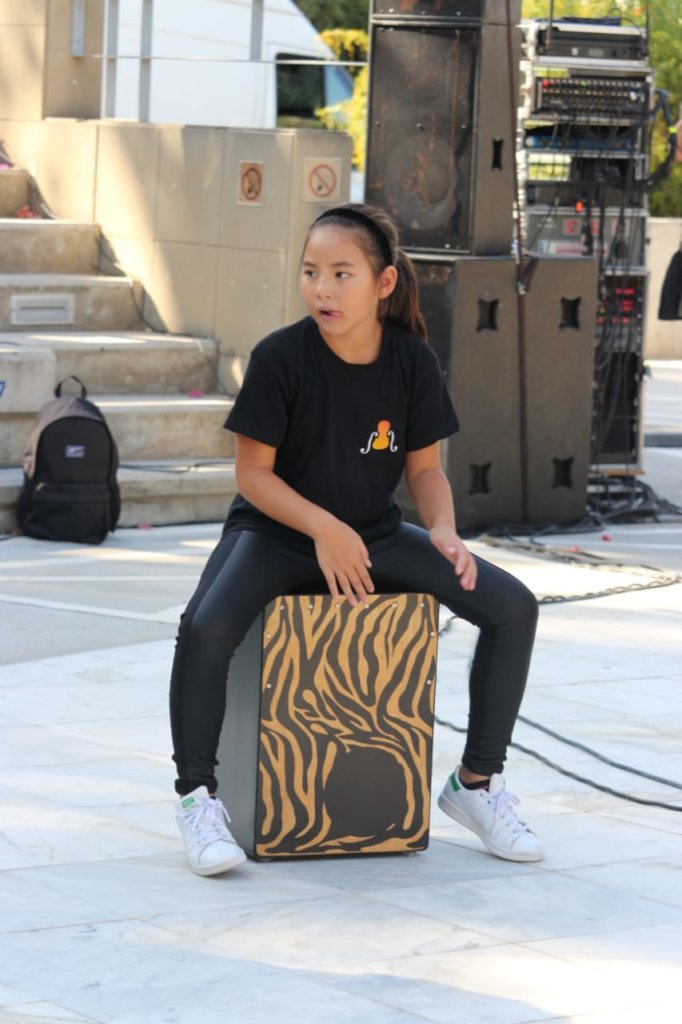 Young musician on her cajon