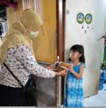 Foodbank distributing bread for children