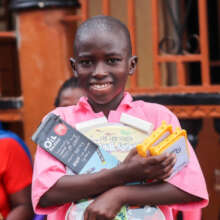 Student in Sierra Leone holding their JuniorBuddy
