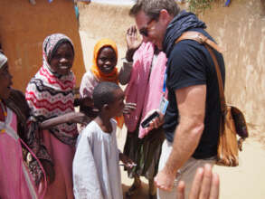 Simon having fun with children in Zimbabwe