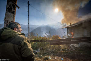 Man burning his house left in the Azerbaijani side