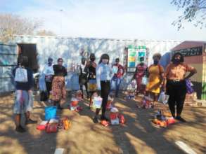 Ikemele women receive a generous monthly food pack