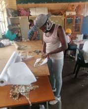 An Ikemele women learns sewing skills