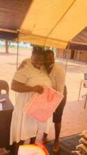 Ikemele graduate receiving her Christmas gift