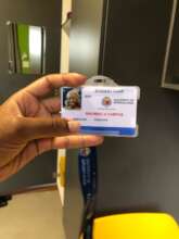 Remoneilwe showing of her student card