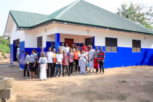 community members in front of the clinic