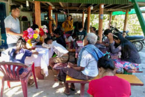 Ven leads prayer at the church near his hometown