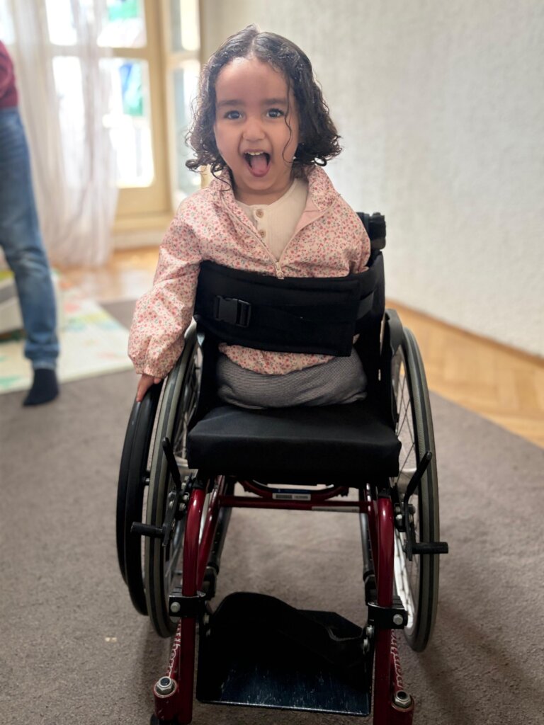 Qamar`s wheelchair is adapted for one handed use.