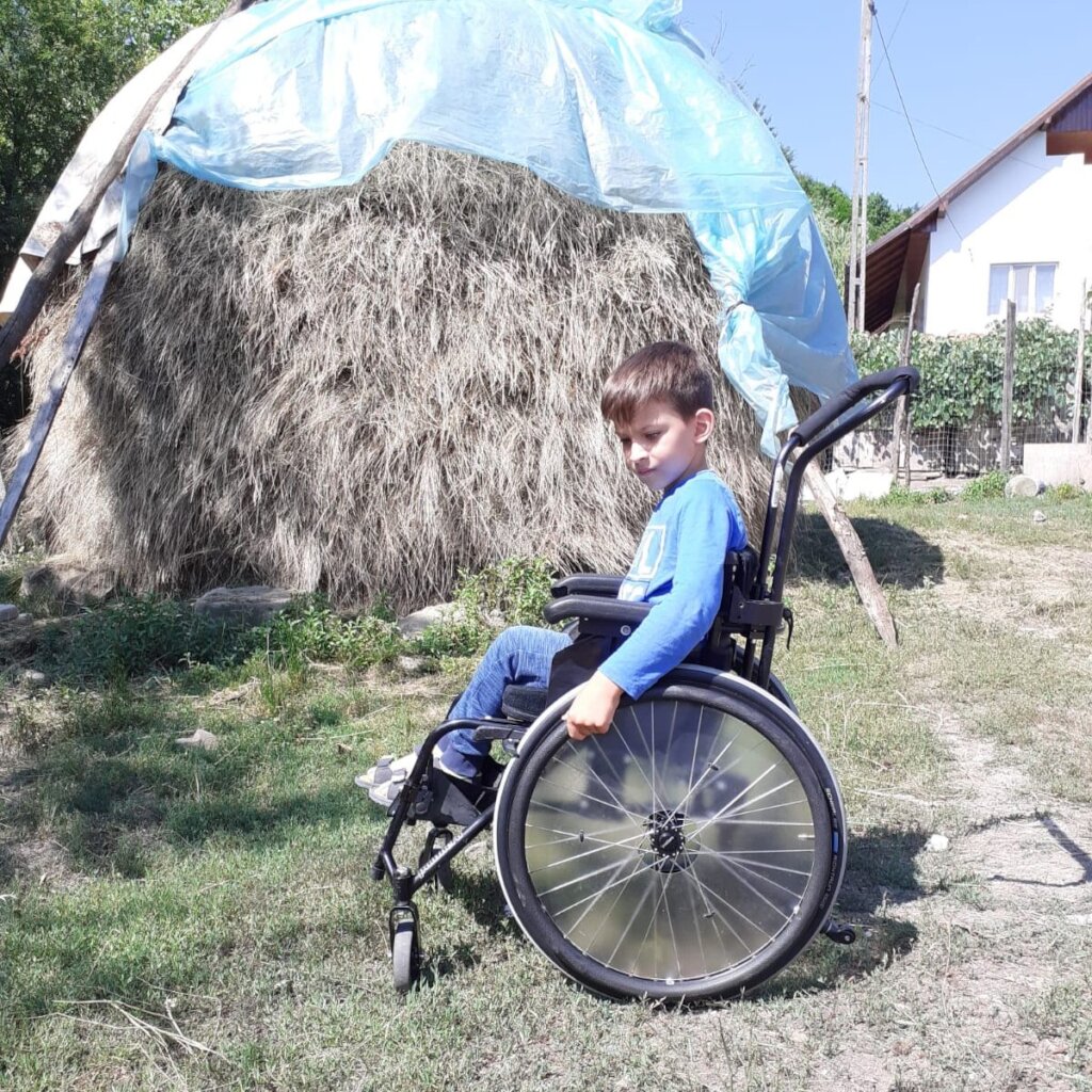 Luca-Timotei is a happy childin his new wheelchair