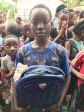 Project beneficiary with school bag
