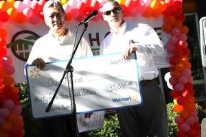 Walmart presents a check for our food programs