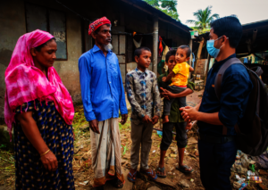 Field worker visiting a family