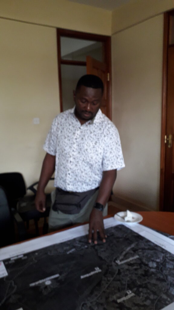 Dr. Nkoba Kiatoko, ICIPE, with project area map