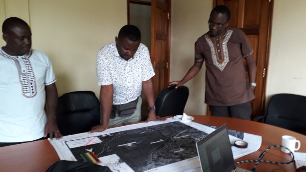 Kisiangani, Kiatoko and Were discussing logistics