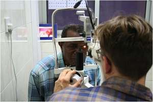 Dr. Bujak examines cornea patient
