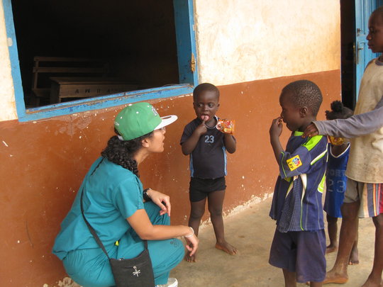 Dr. Zahra speaking with children