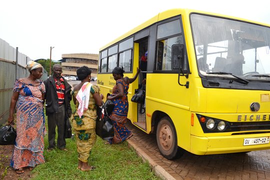 Patients arrive by bus for treatment.