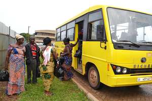 Patients arrive by bus for treatment.