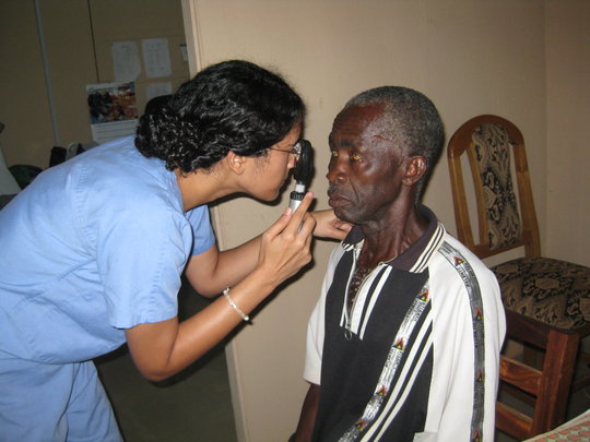 Dr. Zahra examining a patient.