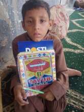 Noman holding a Notebook and Mini board first time