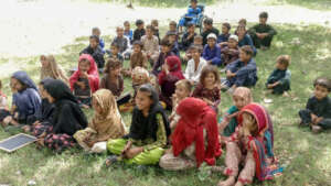 School under trees: Igniting minds.