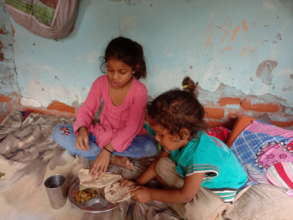 Kids sharing & eating the food