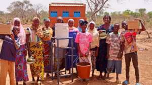 Girls in font of their new latrines
