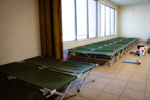 The cots in a migrant shelter for families