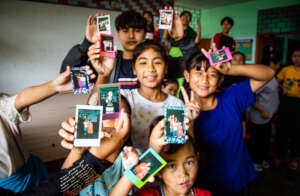 Young girls in India with their Polaroid photos