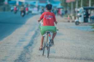 Bicycling home with care package