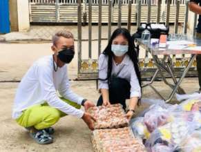 Dove volunteers help distribute care packages