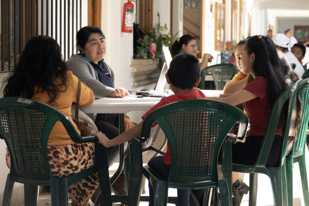 Social worker sharing information with a family