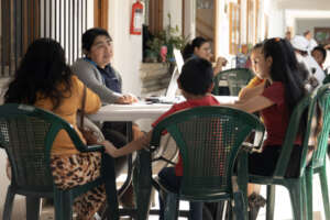 Social worker sharing information with a family