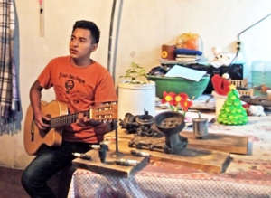 Marco playing his guitar