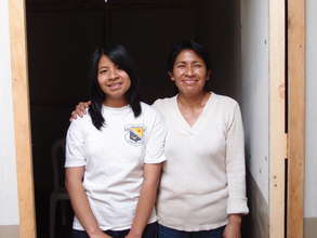 Teresa and her daughter in their new home