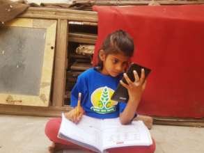 child studying through smart phone